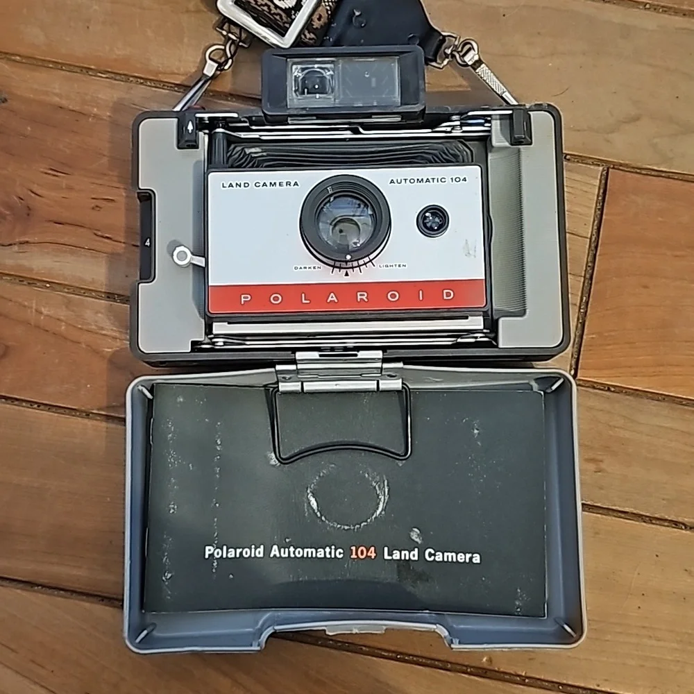 Vintage Polaroid automatic 104 land camera with beautiful strap
